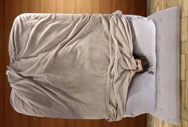 Những mối nguy hại khôn lường của thói quen trùm chăn kín đầu khi ngủ